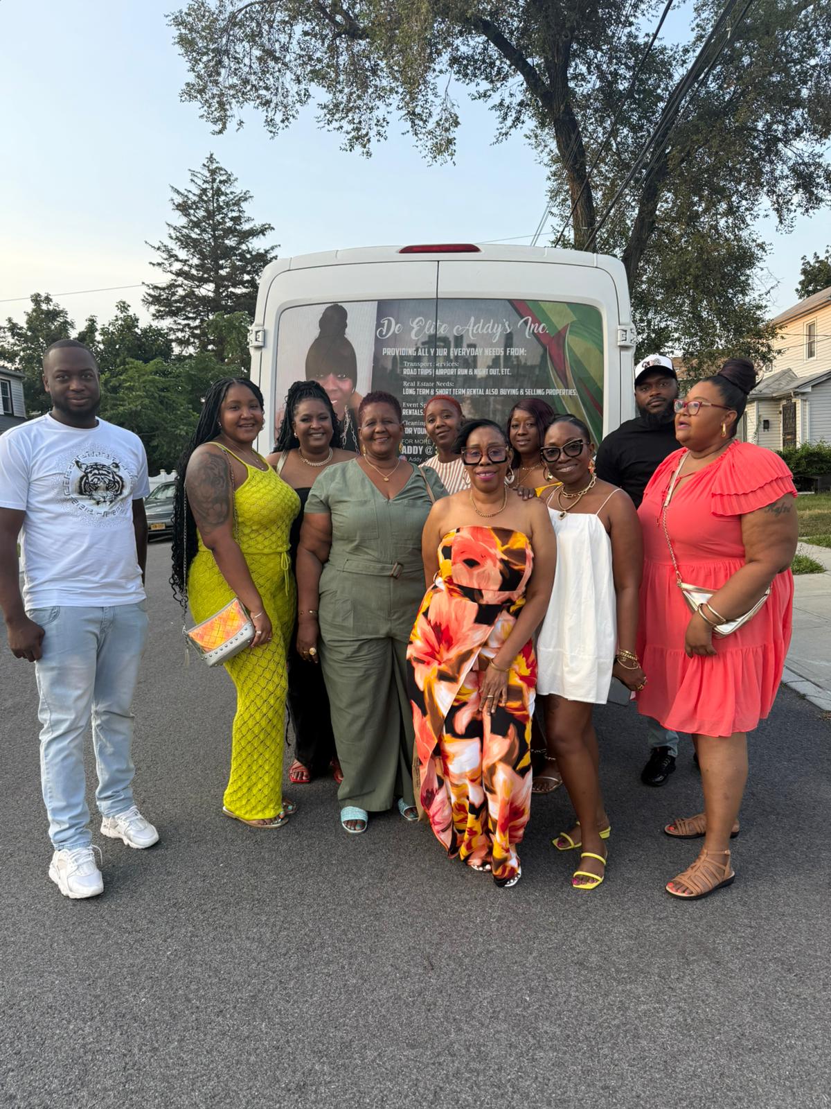 Happy customers posing with Addy On De Go van after a successful group trip